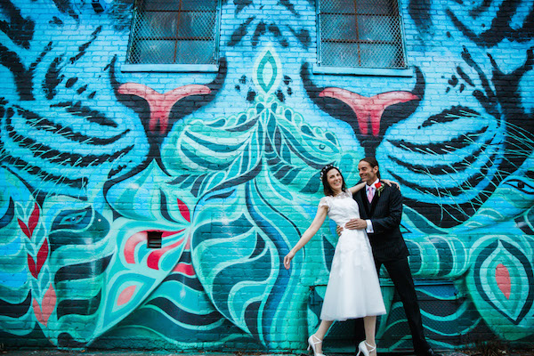 A post-wedding photo shoot at Bushwick Collective favored cat-themed murals. Photo by Jenny MacFarlane/stylishhipweddings.com.