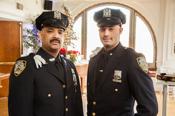 L to R: Police Officer Alberto Ortiz, of Midtown South, and his son, Police Officer Justin Ortiz, of the 46th Precinct. Photo by Leigh Beckett.