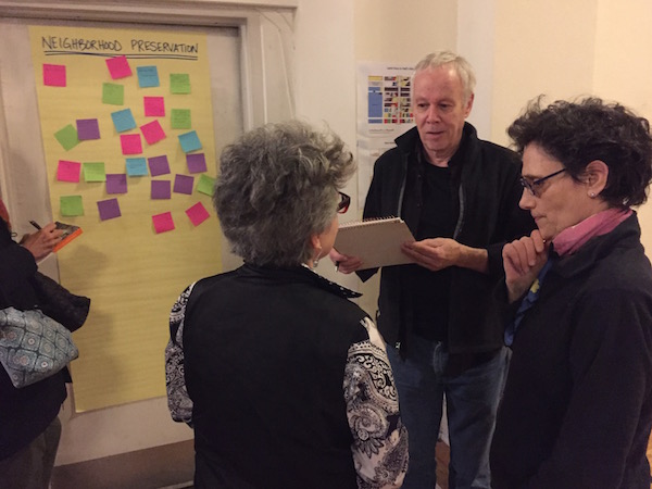 CB4 member JD Noland noted the suggestions of community residents during a brainstorming session whose categories included Small Business/Community Services, Neighborhood Preservation, Air Quality, Parks, Transportation, and Housing. Photo by Eileen Stukane.
