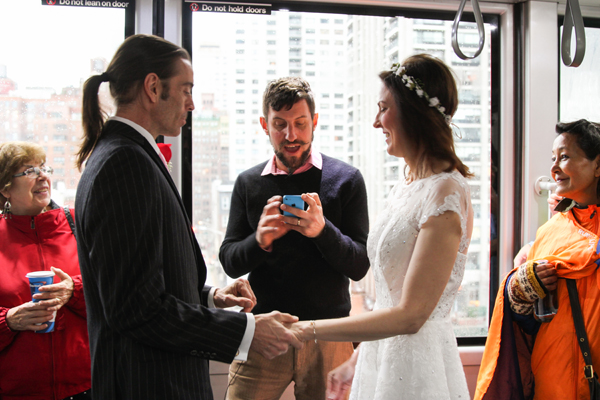 The Most Reverend Matt Levy officiated Wesley Hansen and Jennifer Dreussi Hansen’s wedding on board the Roosevelt Island Tram. | JENNY MACFARLANE/ STYLISHHIPWEDDINGS.COM