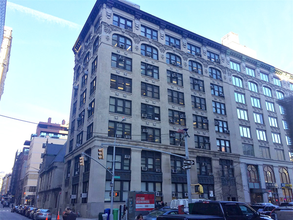 Photo by Dennis Lynch This city-owned building at 137 Centre St. could soon be replaced with a towering condominium, so CB1 is pushing to have its architectural twin at 139 Centre St. preserved as a landmark.