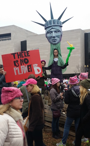 Creative messages included Lady Liberty warning that there is nowhere else to go — so let’s get to work. Photo by Ellen Black.