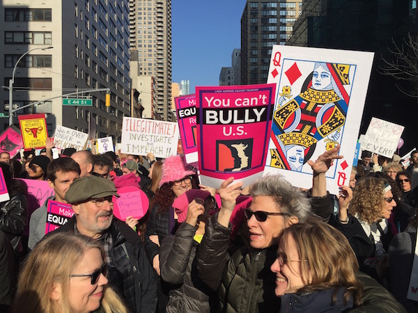 Second Ave. was filled with a wide array of homemade signs. Photo by Paul Schindler.