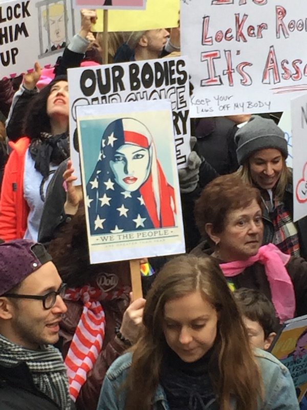 Marchers voiced support for immigrants, refugees, and ethnic and religious minorities. Photo by Paul Schindler.