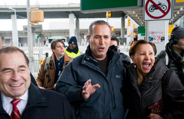 Congressman Jerrold Nadler (left) and Congresswoman Nydia Velazquez (right) escorted Hameed Khalid Darweesh (center), an Iraqi refugee and former translator for the US Army, out of Terminal 4 where he was detained as a consequence of an executive order by President Trump. Photo by Julius Constantine Motal.