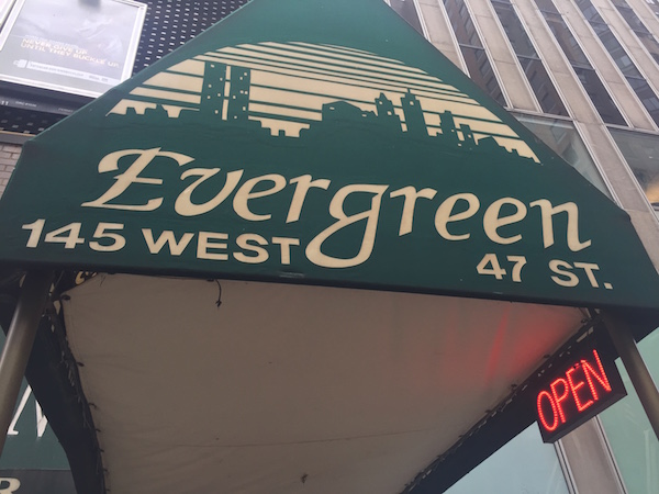 The “OPEN” sign was illuminated for the penultimate time at the Evergreen on Dec. 30. Photo by Dennis Lynch.