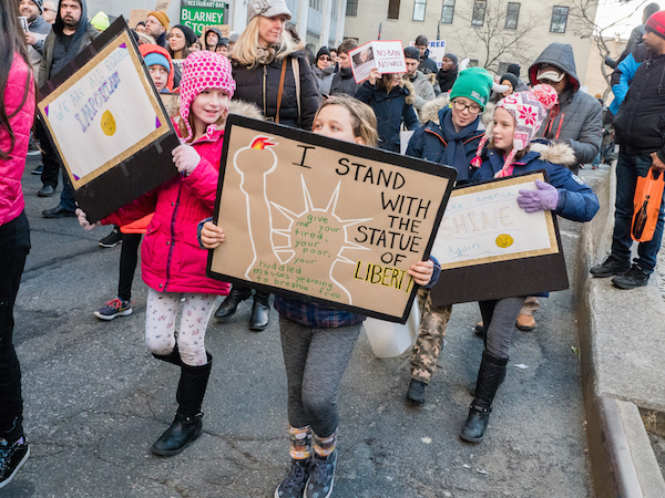 A Sun., Jan. 29 rally was held at The Battery to put the Statue of Liberty in the background of the protest, and the symbolism wasn’t lost on the demonstrators. Photo by Milo Hess.