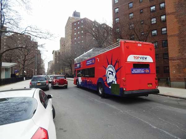 A bus cruising eastbound on W. 26th St. between 10th and Eighth Aves. will pass a community center, a day care, an elementary school, a playground, and a city park in those two blocks. Photos by Dennis Lynch. 