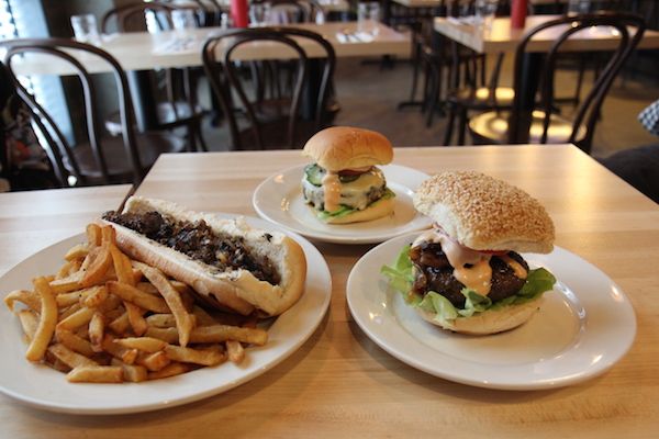 L to R: The East Villi Cheese Steak, Whitmans’ classic cheeseburger, and the unrivaled Juicy Lucy. Photo by Dennis Lynch.