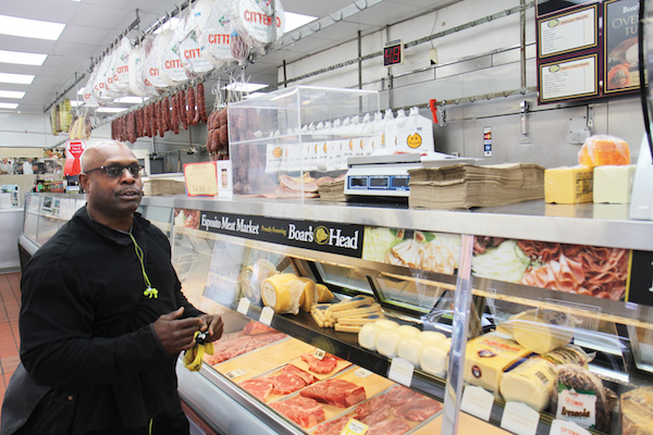 Chelsea resident Curtis Jewell has been coming to Esposito Meat Market for 20 years for cold cuts, sausage, ground beef, and steak. Photo by Dennis Lynch.