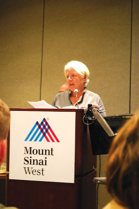 London Terrace Towers resident Ann Northrop testifies against granting a liquor license to 463 W. 23rd St. Photo by Winnie McCroy.