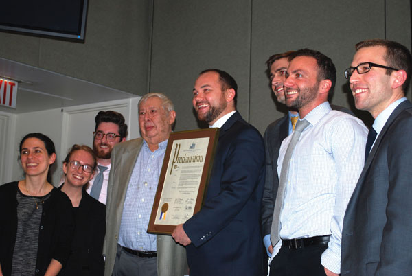 City Councilmember Corey Johnson (center) proclaims April 7 Walter Mankoff Appreciation Day (Mankoff, to the left of Johnson). Sarah Desmond received similar honors. Photo by Winnie McCroy.