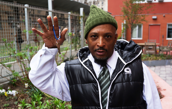 After years sleeping in parks, Clovis Ahmed proudly displays the keys to his studio apartment at The Lee in Manhattan's Lower East Side, obtained with the help of Breaking Ground. Photo via Breaking Ground.