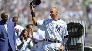 Yankees shortstop Derek Jeter waves to the crowd at Yankee Stadium during Derek Jeter Day on Sunday, Sept. 7, 2014