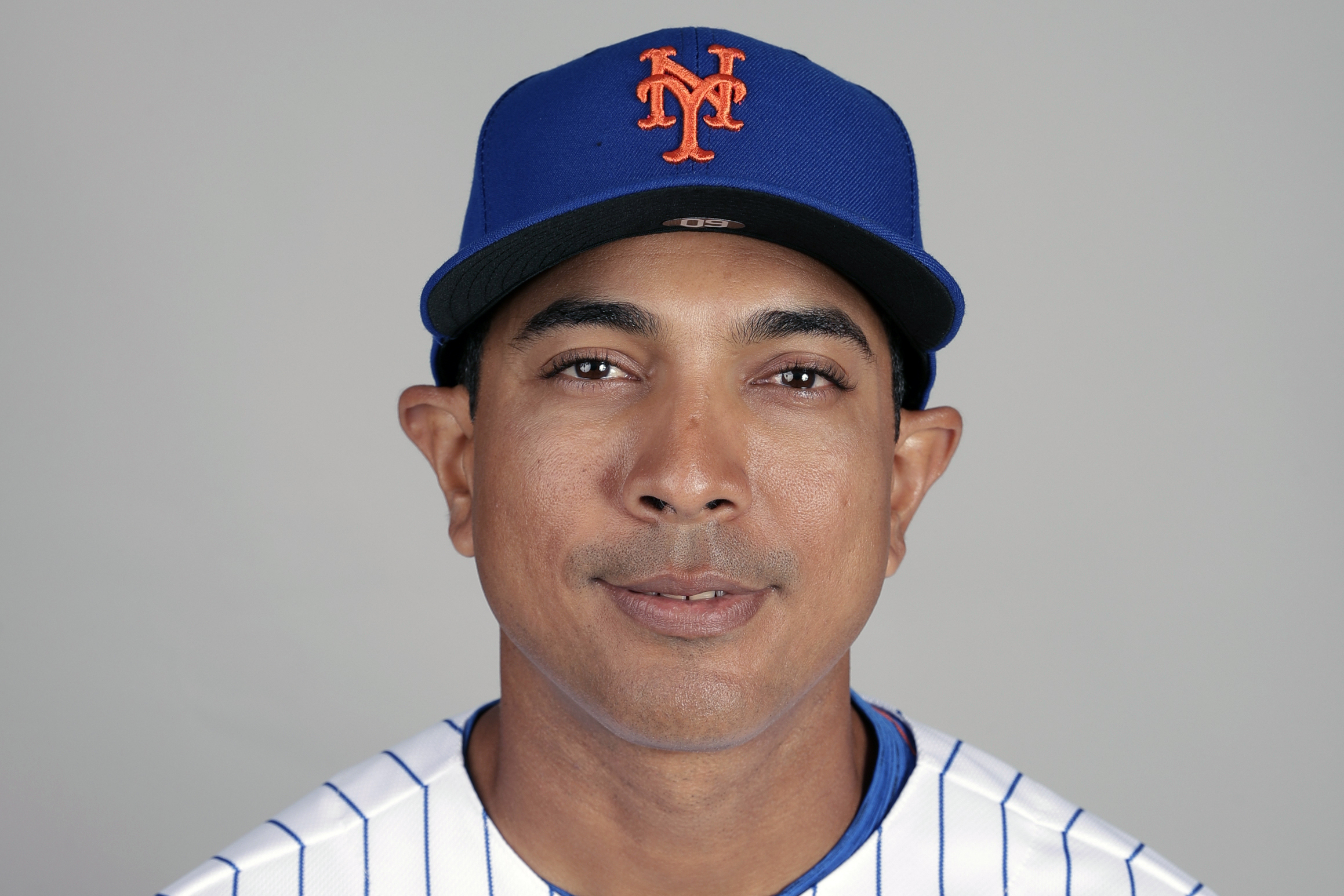 New York Mets manager Luis Rojas walks to the mound for a pitching