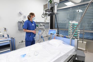 Anesthesiologist Sylvie Thierbach of the German armed forces Bundeswehr stands in front of a bed in the intensive care unit of the Ulm Bundeswehr hospital