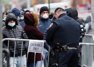 People wait in line to be tested for coronavirus disease (COVID-19) outside Elmhurst Hospital Center in the Queens borough of New York