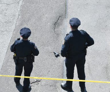 Cops watch over a handgun at the scene of a shooting on Pennsylvania Avenue and Liden Blvd.