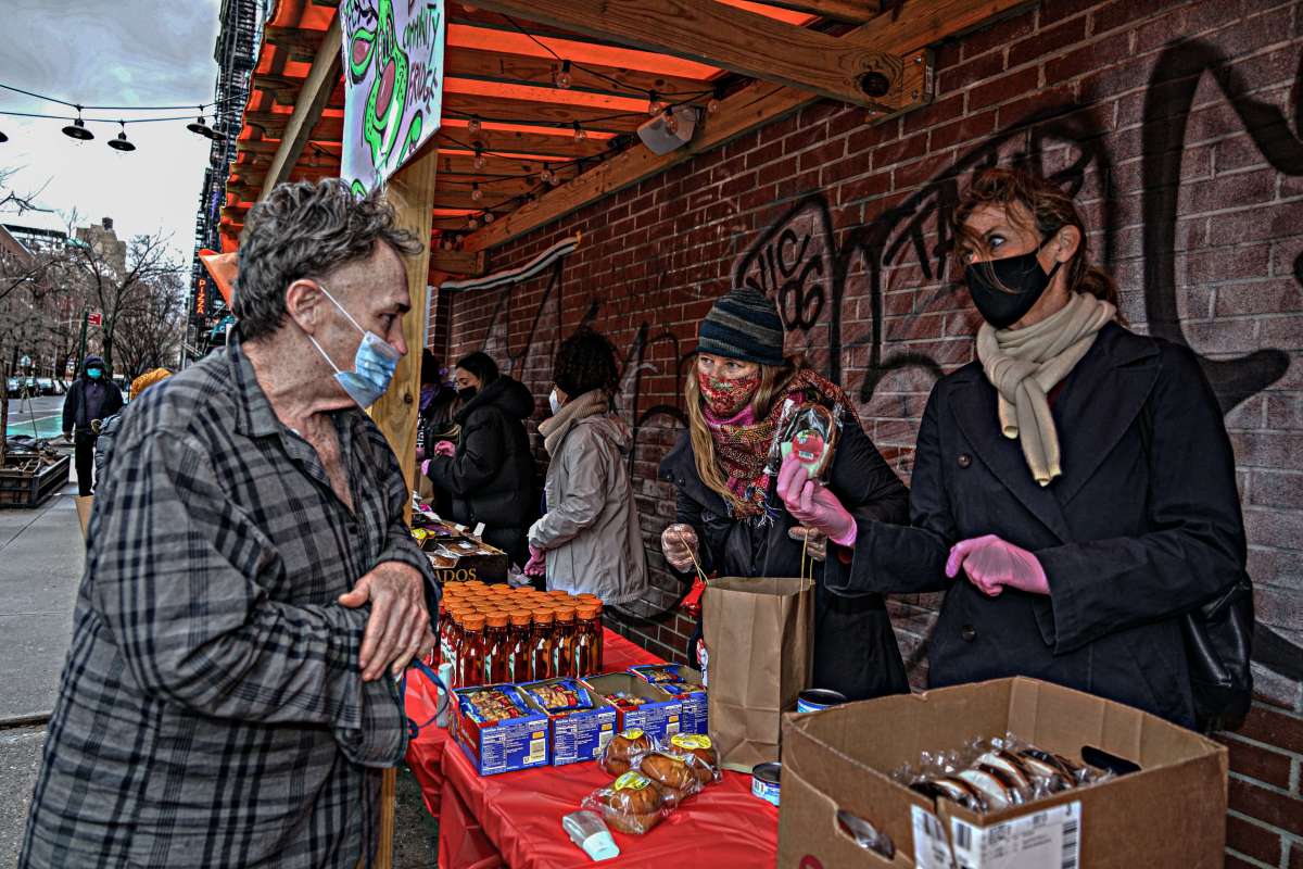 Volunteers with East Village Neighbors helped distribute dozens of meals on Christmas Day