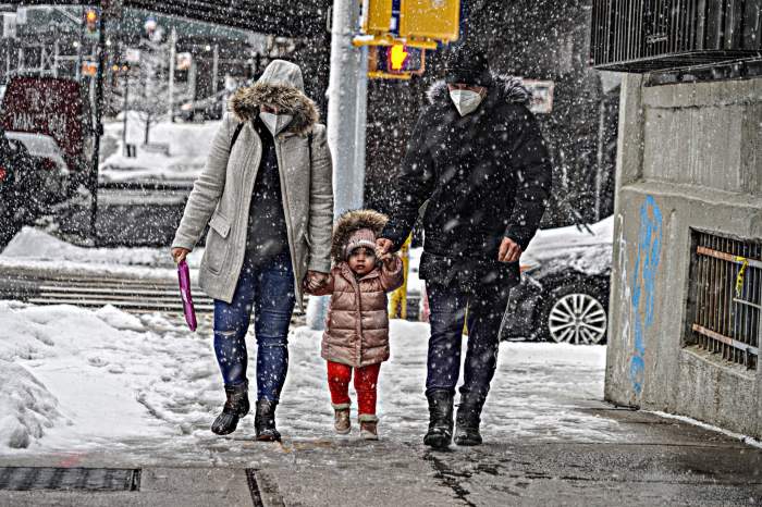 A family trudges through the snowstorm in Williamsburg, Brooklyn on Feb. 7, 2021.