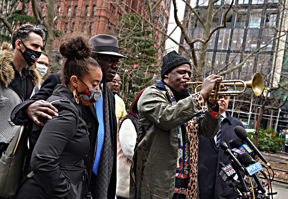 Keyon Harrold Sr. played "This land is your land," on his trumpet