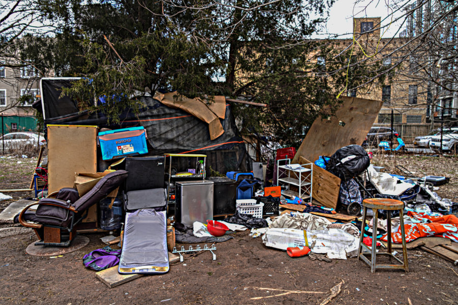 Sign Of The Times: A Homeless Encampment Rises Amid Traffic Near The ...