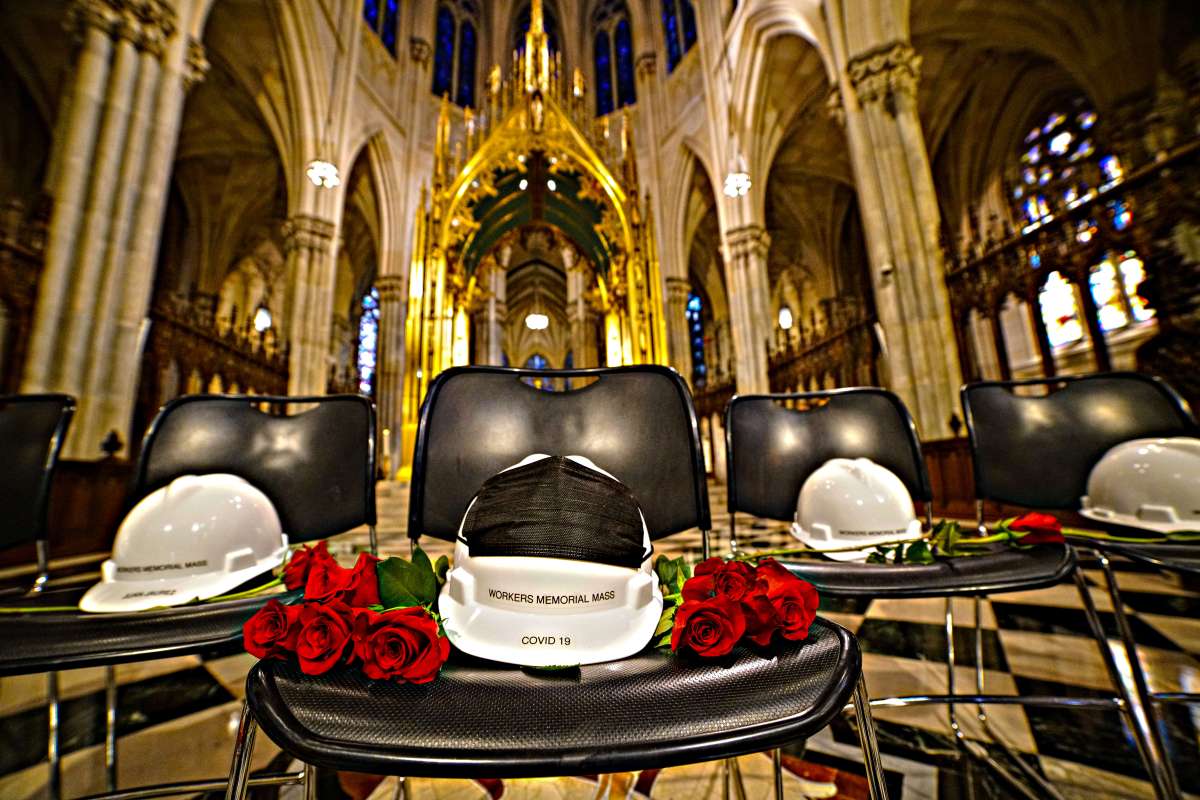 Hard hats on chairs represented the lives lost