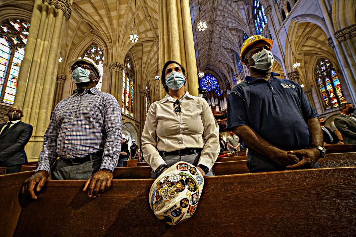 Lowering their hats, workers paid their final respects