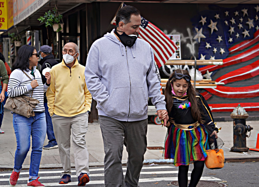 TRICK OR TREAT! Ghosts and goblins of all ages venture across Manhattan