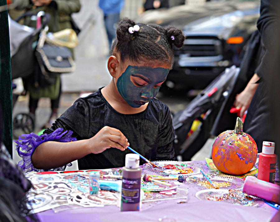 TRICK OR TREAT! Ghosts and goblins of all ages venture across Manhattan