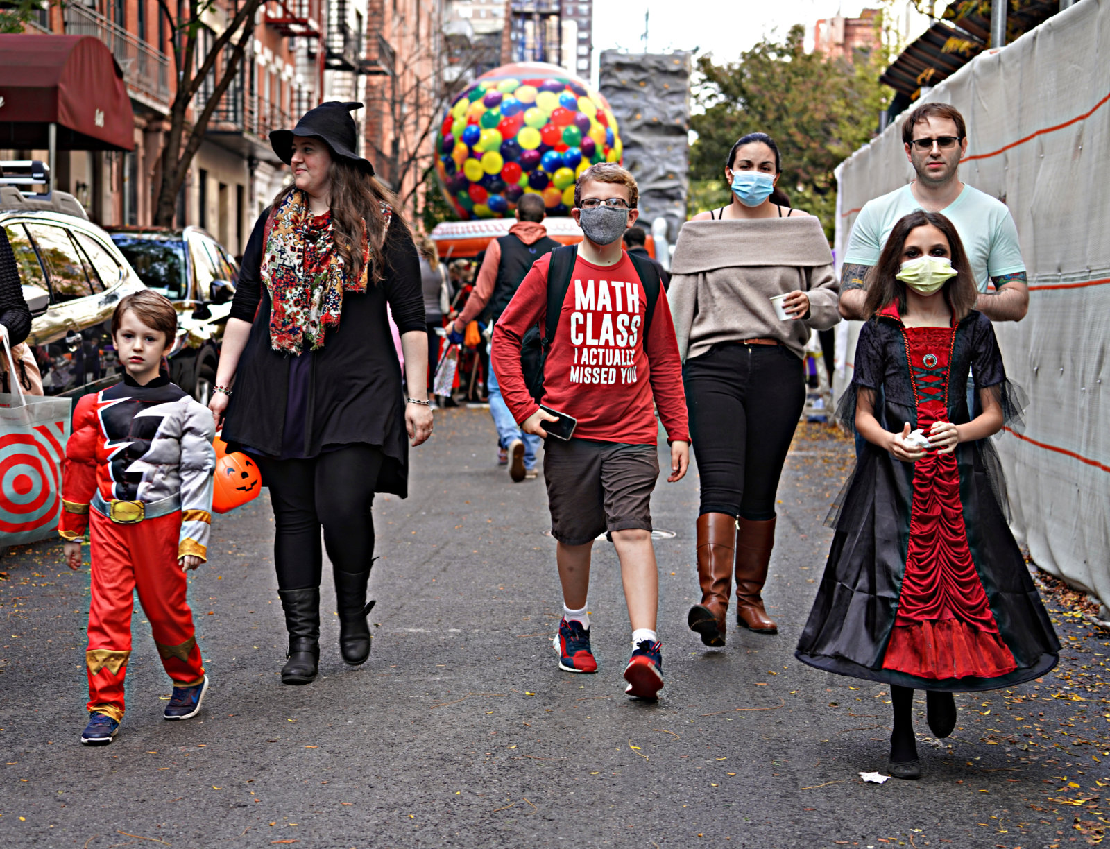 TRICK OR TREAT! Ghosts and goblins of all ages venture across Manhattan