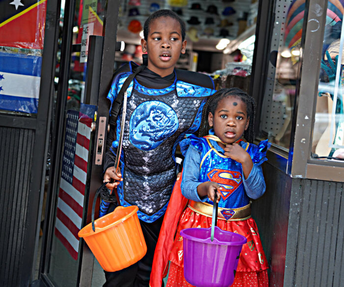 TRICK OR TREAT! Ghosts and goblins of all ages venture across Manhattan