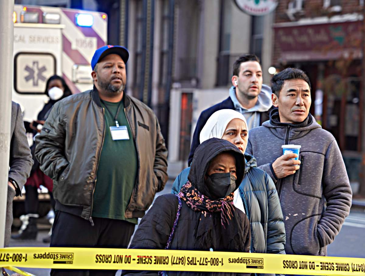 Onlookers gather