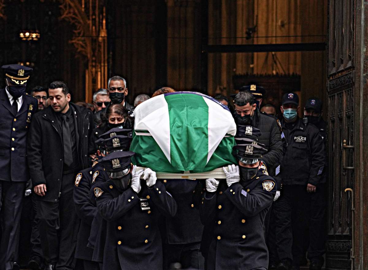 Officer Mora's casket emerges from St. Patrick's Cathedral