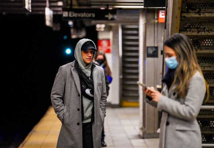 Riders seen with and without masks at the 14th Street station at 8th Avenue in Manhattan on March 27, 2022.