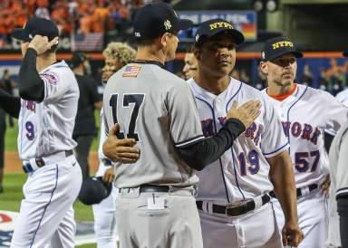 Yankees manager Aaron Boone and former Mets manager Luis Rojas.