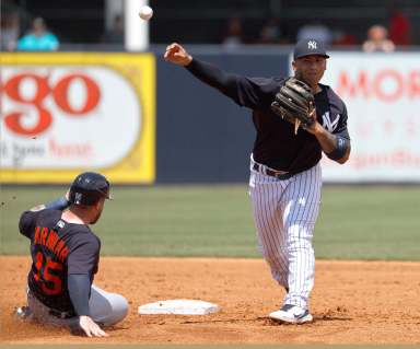 Yankees second baseman Gleyber Torres forces out Detroit Tigers catcher Tucker Barnhart.