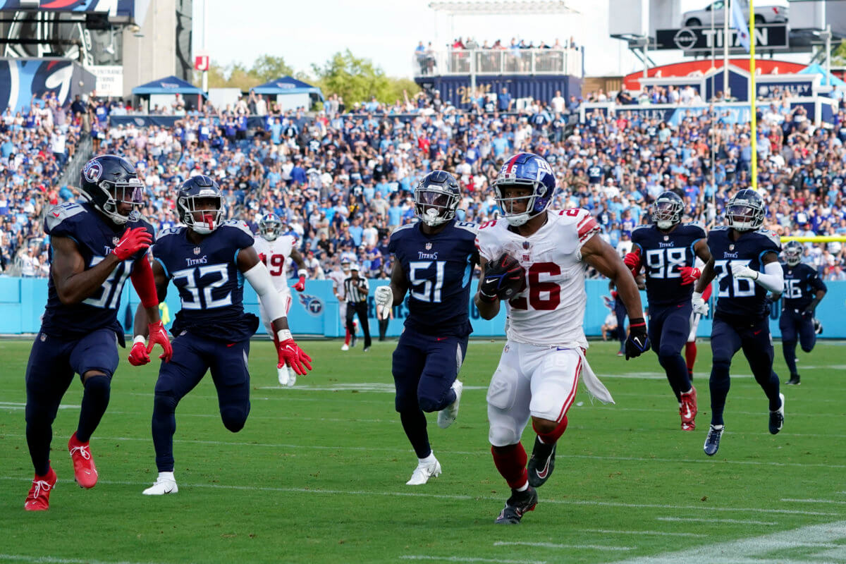 New York Giants running back Saquon Barkley (26) runs with the ball against  the Carolina Panthers during an NFL football game Sunday, Sept. 18, 2022,  in East Rutherford, N.J. (AP Photo/Adam Hunger