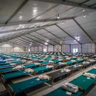 Lines of cots at the migrant tent city set up on Randall's Island