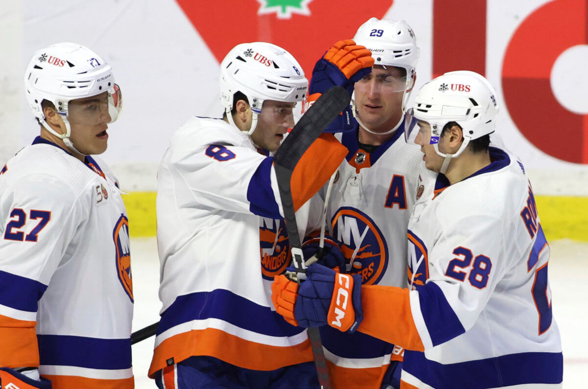 Dobson scores in OT to rally Islanders past Flames, 4-3