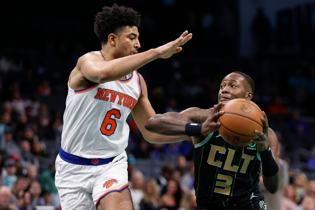 New York Knicks' Quentin Grimes looks to pass the ball against the Orlando  Magic during the first half of an NBA basketball game, Tuesday, Feb. 7,  2023, in Orlando, Fla. (AP Photo/John
