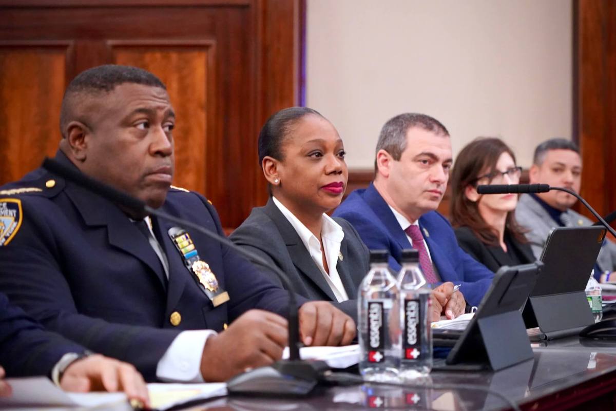 NYPD Chief of Department Jeffrey Maddrey (left) testifies to the City Council next to Commissioner Sewell