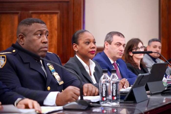 NYPD Chief of Department Jeffrey Maddrey testifies to the City Council next to Commissioner Sewell