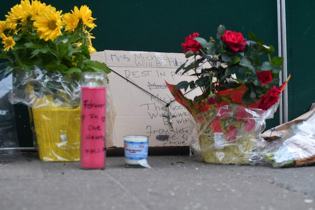 A memorial outside the deli Monday morning