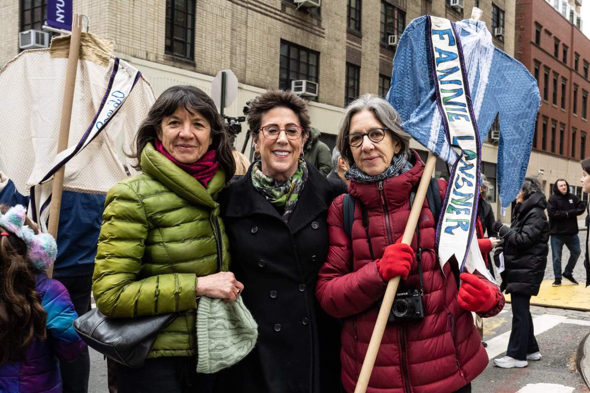 Descendants of Fannie Lansner carry a sashed blouse with her name