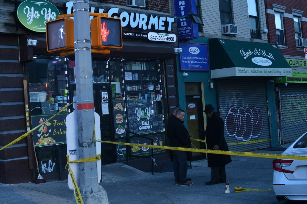 Detectives outside the bodega