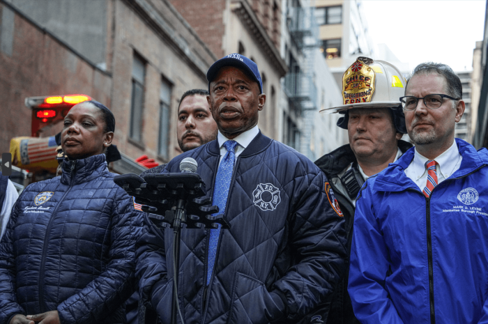 Mayor Eric Adams briefs the media on the garage collapse