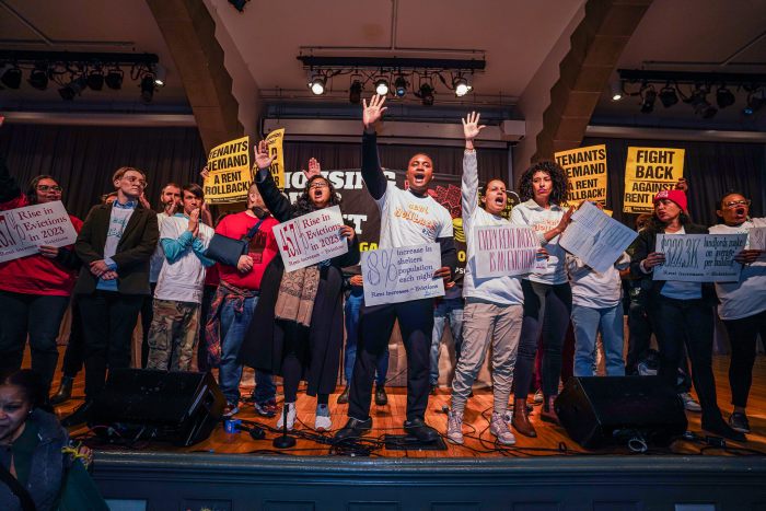 Elected officials and tenant advocates storm the stage at the Rent Guidelines Board to demand a rent rollback