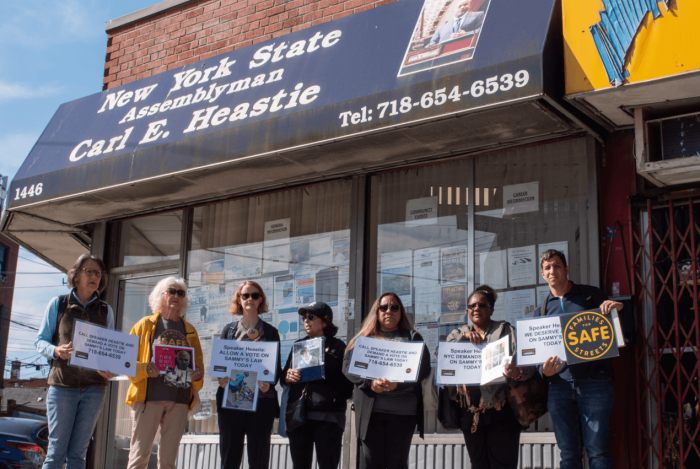 Members of Families for Safe Streets rally outside Speaker Carl Heastie's office