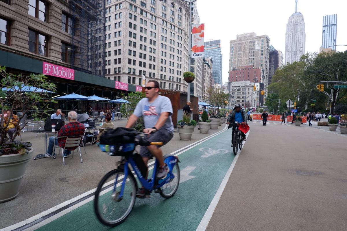 man rides a Citi Bike on Broadwa